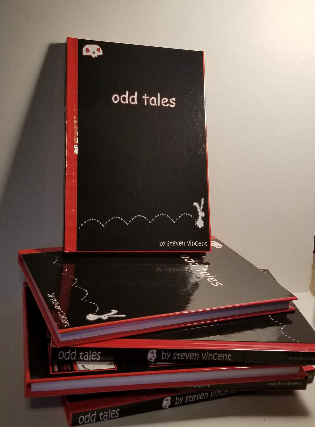 Odd Tales anthology. 144 pages of cute yet macabre illustrated stories. Hardcover signed with a sketch.