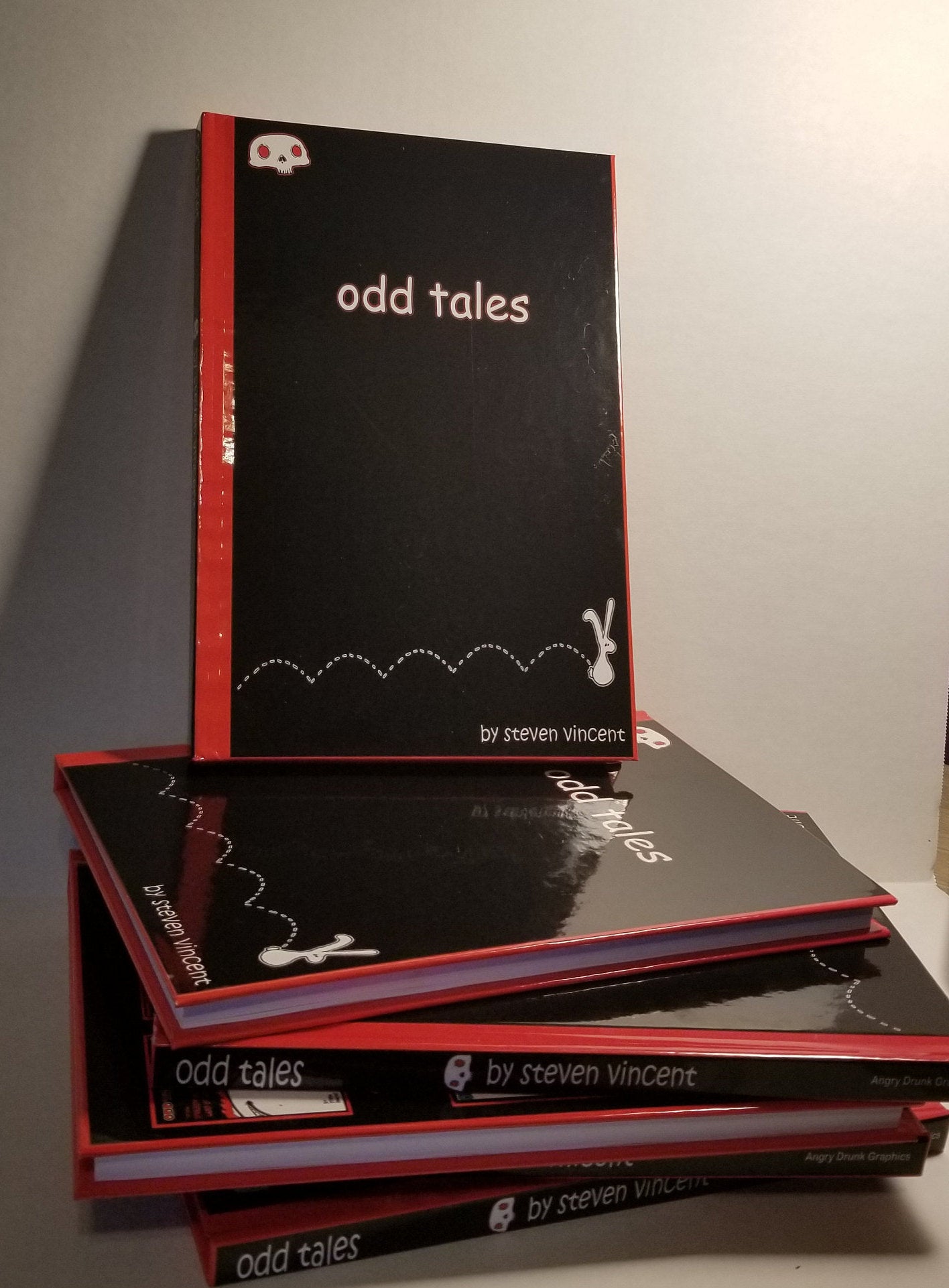 Odd Tales anthology. 144 pages of cute yet macabre illustrated stories. Hardcover signed with a sketch.